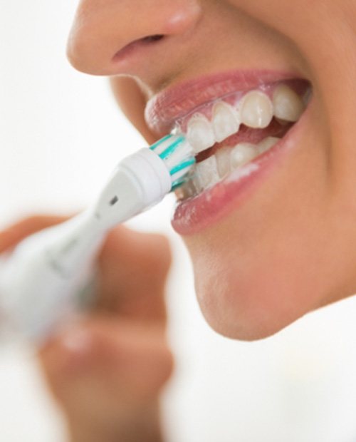 Woman brushing her teeth