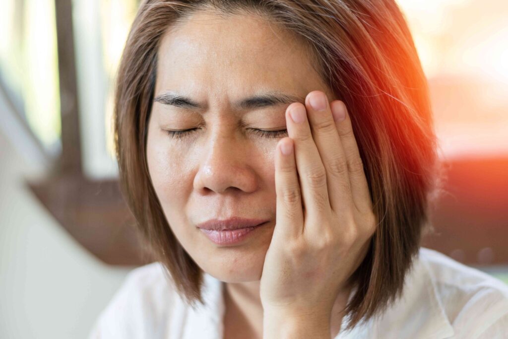 Woman with jaw pain